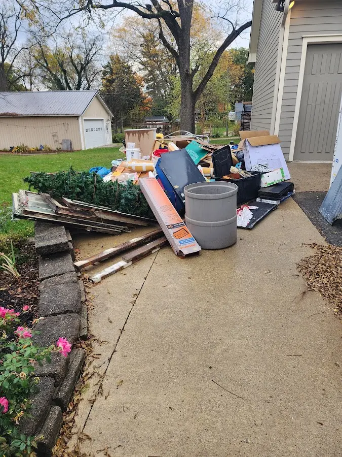 Dumpster being loaded with debris for Residential Dumpster Rental in Venus